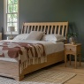 Gallery Direct Malvern 5'0 King Size Bed in bedroom next to bedside chest against grey painted wall