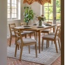 Gallery Direct Malvern Dining Chair with matching table and plates on top