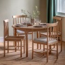 Eton round extending dining table and chairs in a natural wood finish