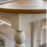 Eton White round extending dining table leg detail with oak top by Gallery Direct