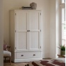 Gallery Direct Eton white painted wardrobe with two doors and a drawer in a classic country bedroom setting