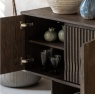 Open view of Gallery Direct Onda 4 door sideboard showing walnut interior shelving and sculpted wave front detail