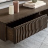 Close up of Gallery Direct Onda 1 drawer coffee table in walnut showing sculpted wave drawer detail