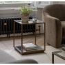 Gallery Direct Avento bronze glass side table beside armchair