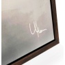 Artist signature detail on golden treeline framed canvas wall art