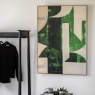 Emerald abstract framed canvas wall art displayed in contemporary interior setting
