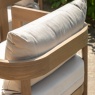 Detail of the curved acacia wood armrest and powder-coated aluminium frame on a Madeira lounge chair.
