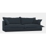 Tetrad Ava Grand Sofa side profile view in blue loose cover fabric showing the deep-seated slouchy design and 252cm width.