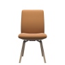 Stressless Laurel Low Back Dining Chair D200 in Batick Caramel leather – modern ergonomic dining chair front view.