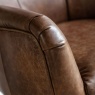 Close-up of Gallery Direct Bristol Brown Leather Swivel Chair arm and genuine leather upholstery